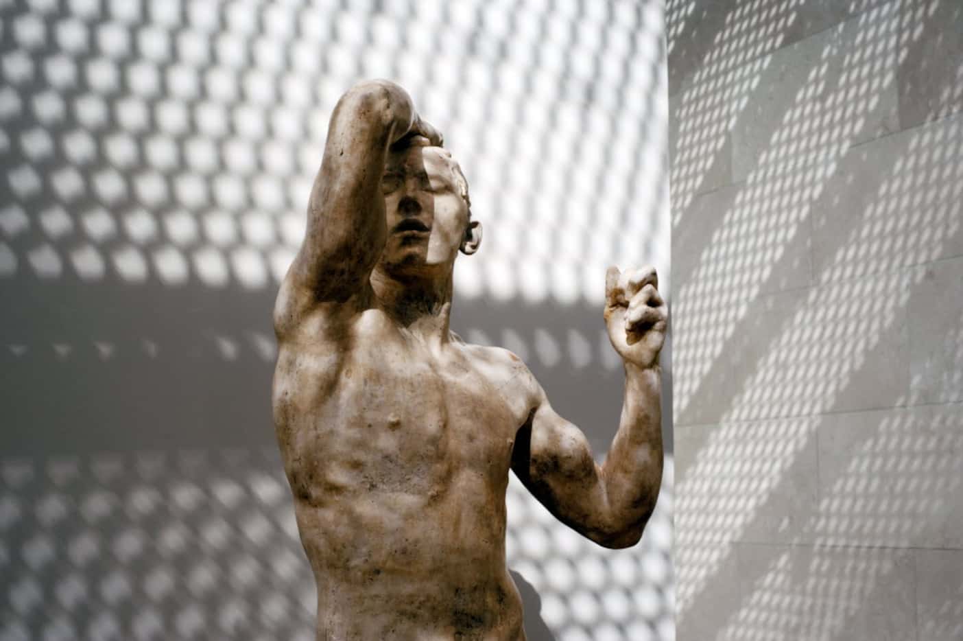 Glare from a new condo tower shines light onto Auguste Rodin's sculpture, Age of Bronze, on...