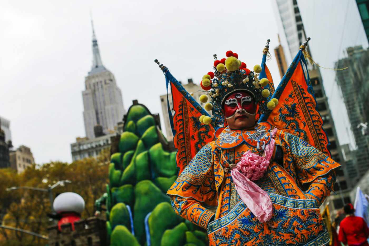 Revellers take part during the 90th Macy's Annual Thanksgiving Day Parade on November 24,...