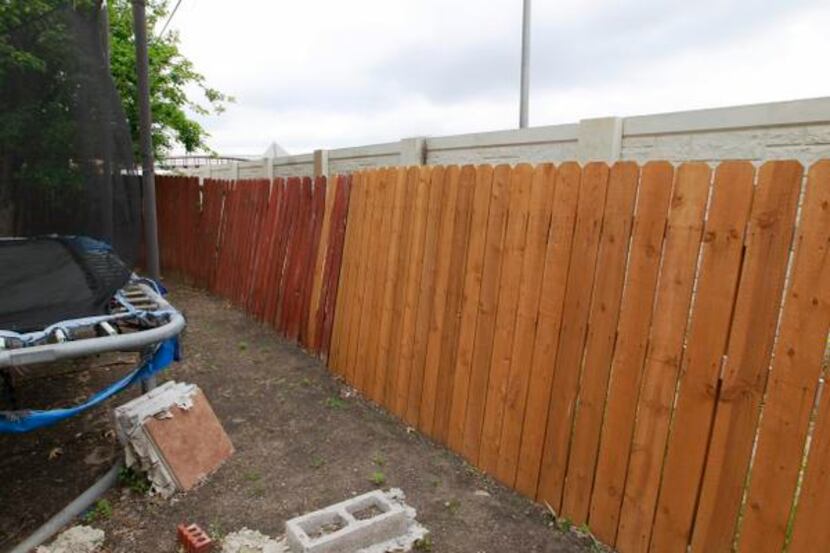 
The freeway runs behind Maria Cazares’ backyard fence, which is also damaged. She has...