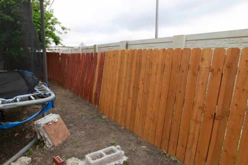 
The freeway runs behind Maria Cazares’ backyard fence, which is also damaged. She has...