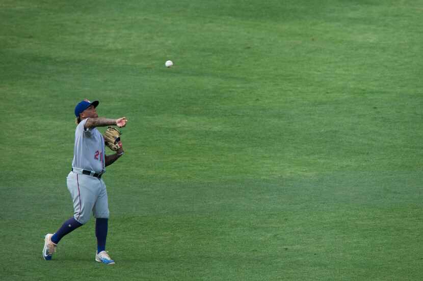 Round Rock Express left fielder Willie Calhoun throws in the ball during a match-up between...