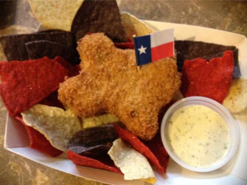 Deep Fried King Ranch Casserole is Texas shaped and served over red, white and blue tortilla...
