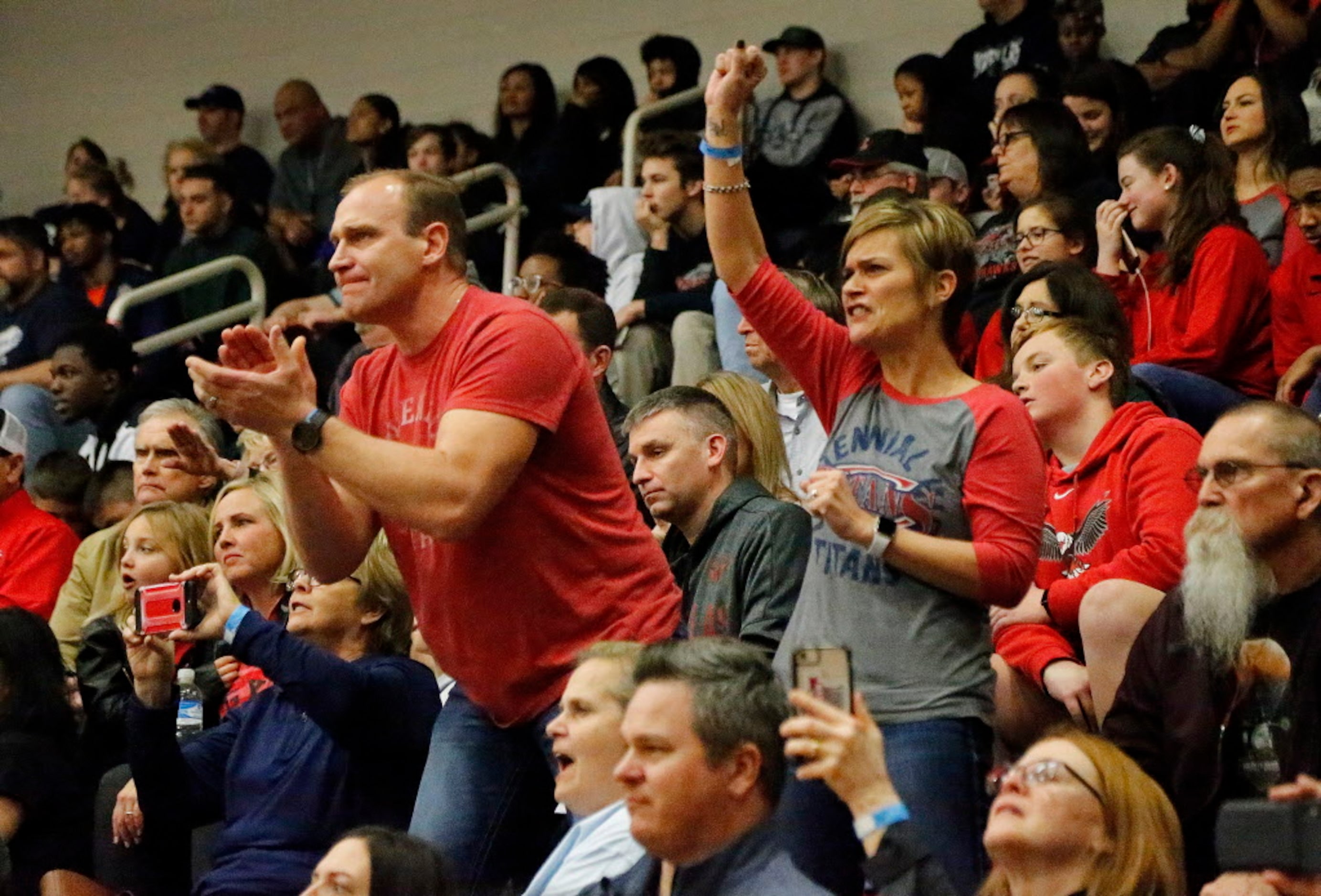 Frisco Centennial supporters cheer for Tyten Volk in the 106 lb. championship match during...