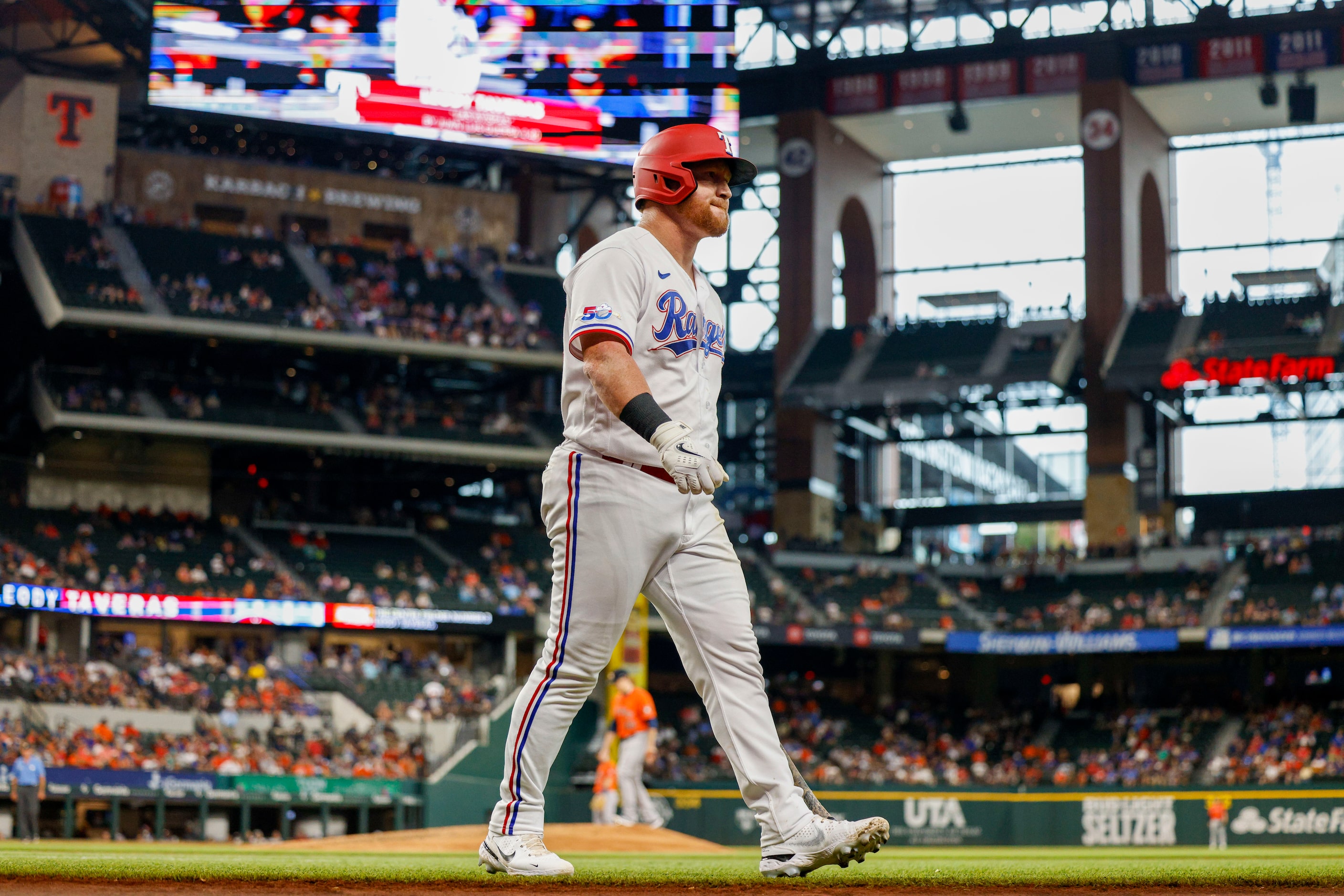 Texas Rangers right fielder Kole Calhoun (56) walks to the dugout after a strikeout during...