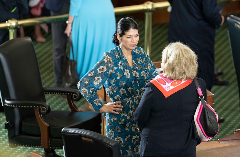 State Sen. Carol Alvarado, D-Houston, talked with retiring Sen. Jane Nelson (right),...