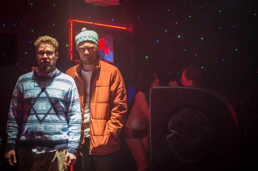 Seth Rogen, left, as Isaac, and Michael Shannon as Mr. Green