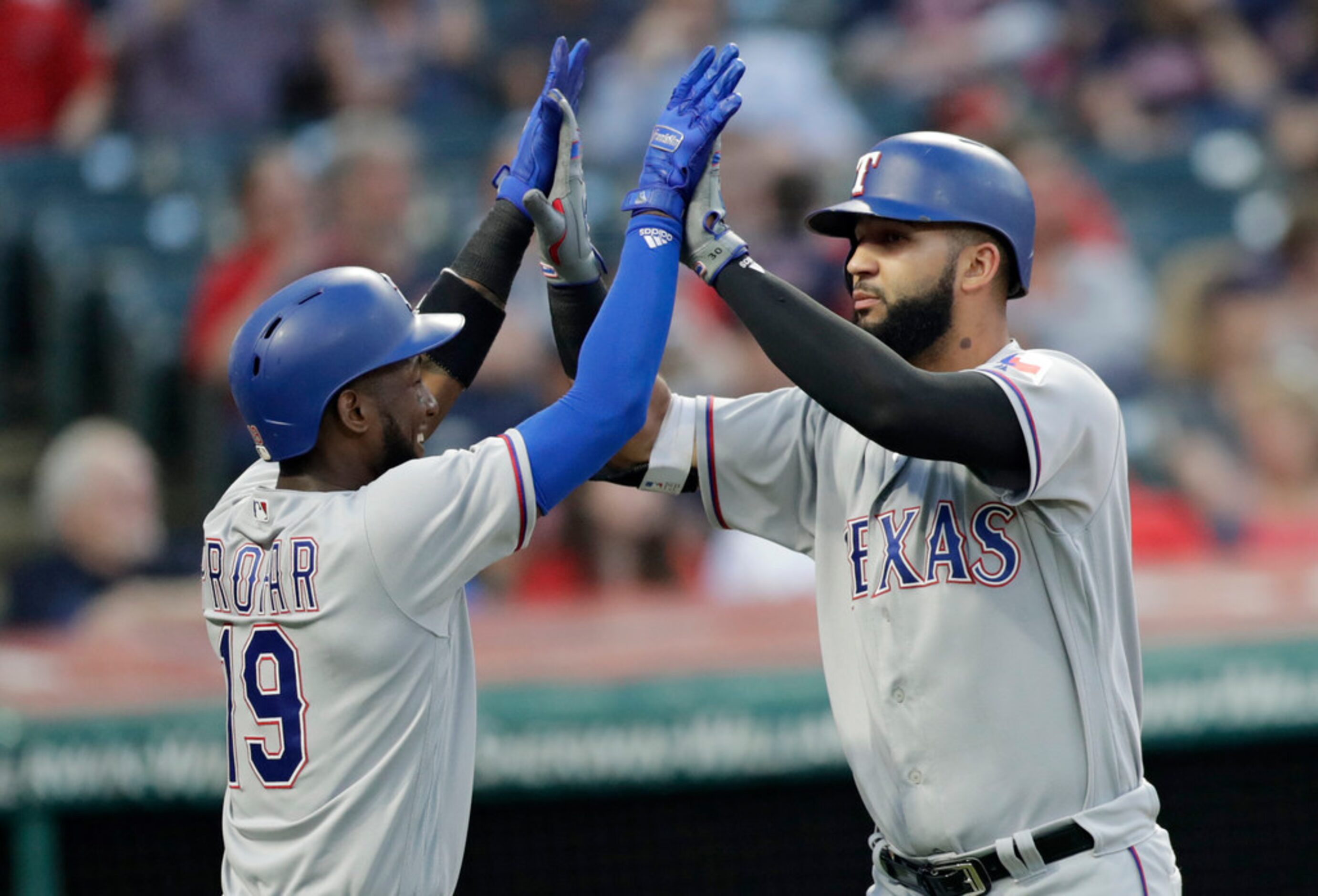 Texas Rangers' Nomar Mazara, right, is congratulated by Jurickson Profar after Mazara hit a...