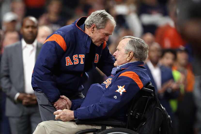 HOUSTON, TX - OCTOBER 29:  Former United States Presidents George H.W. Bush and George W....