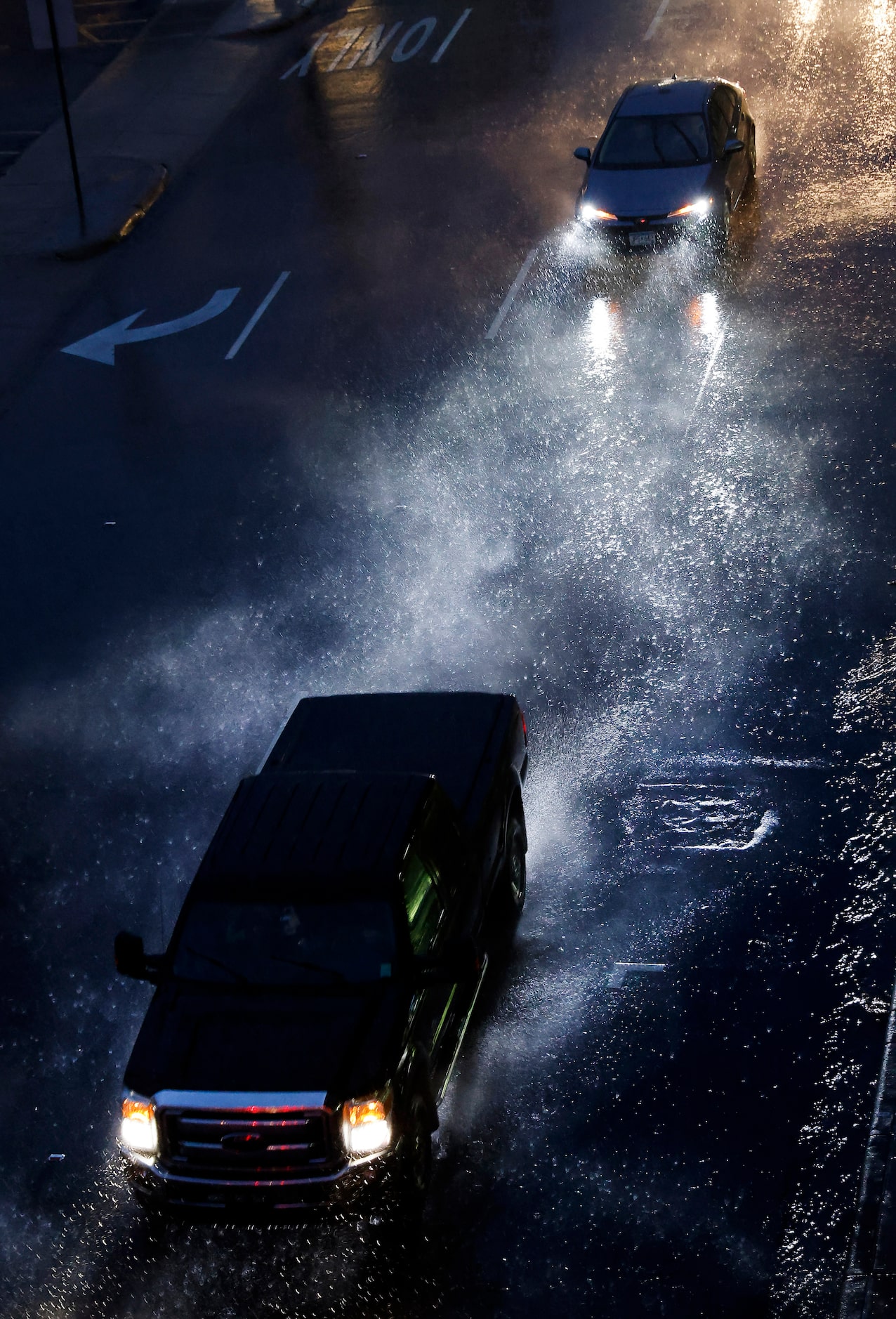 Howling winds from a line of storms blow rain and spray in downtown Fort Worth,  March 2, 2023.