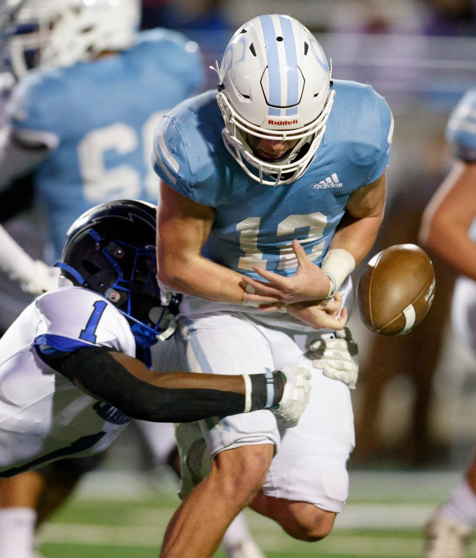 Dallas Christian defensive back Chris Scott (1) forces a fumble from Houston Cypress...