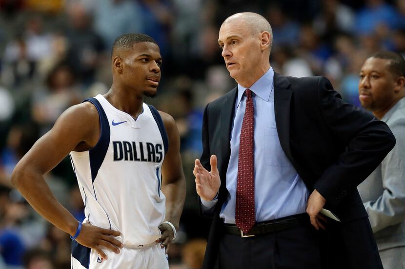 Dallas Mavericks guard Dennis Smith Jr. (1) talks with head coach Rick Carlisle in the first...