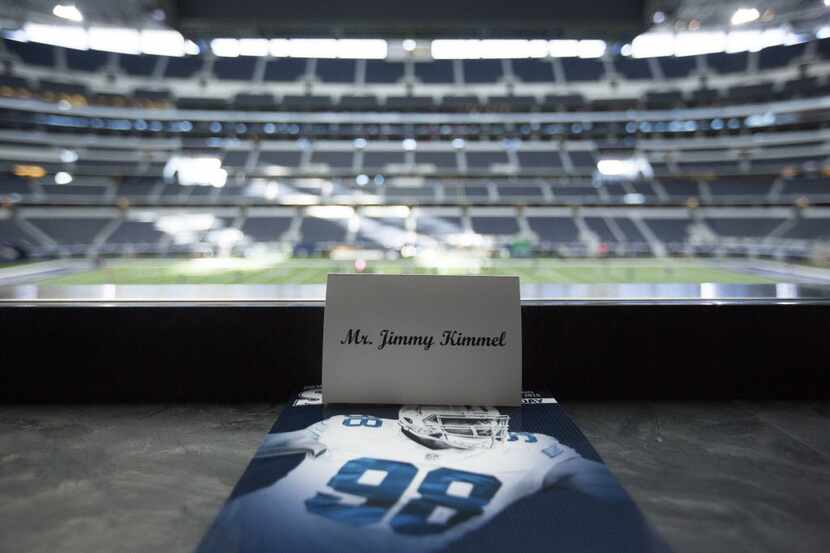 Jimmy Kimmel's place card awaits him in the owner's suite at AT&T Stadium for Saturday's...