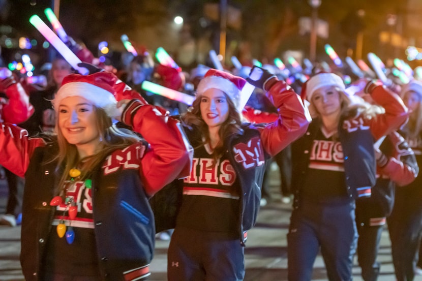 Members of the Martin High School drill team walked down Main Street in Arlington during the...