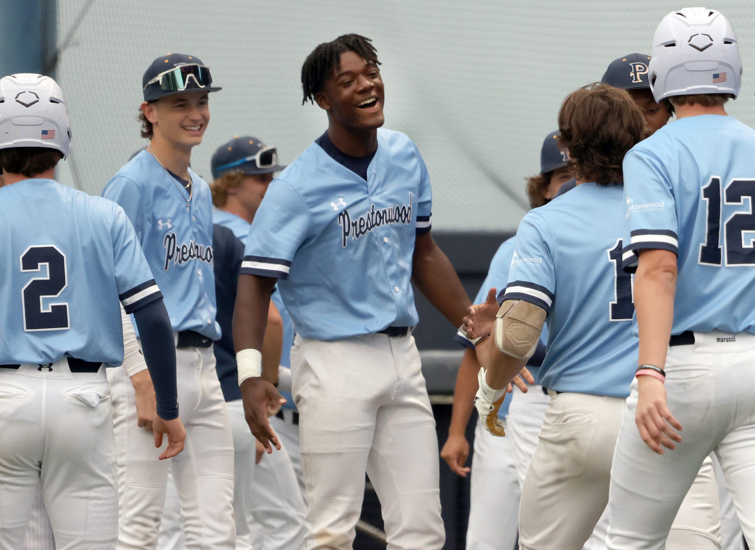 Prestonwood Christian Academy freshman outfielder Lash Henderson (4), center, was all smiles...