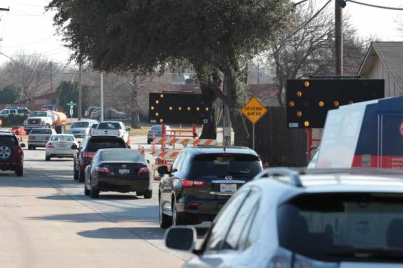 Traffic is forced to avoid the left lane on Alma Drive between Parker Road and Spring Creek...