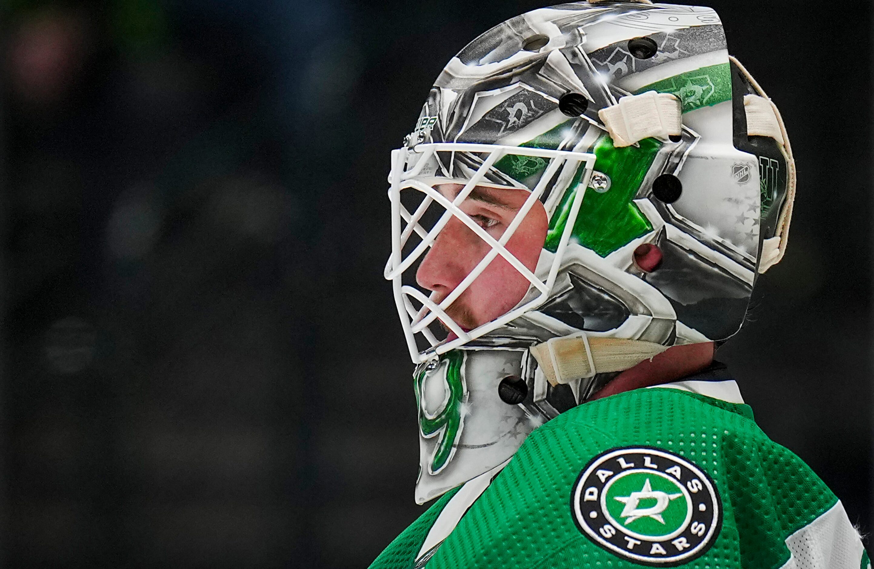 Dallas Stars goaltender Jake Oettinger (29) looks out from the net during the second period...