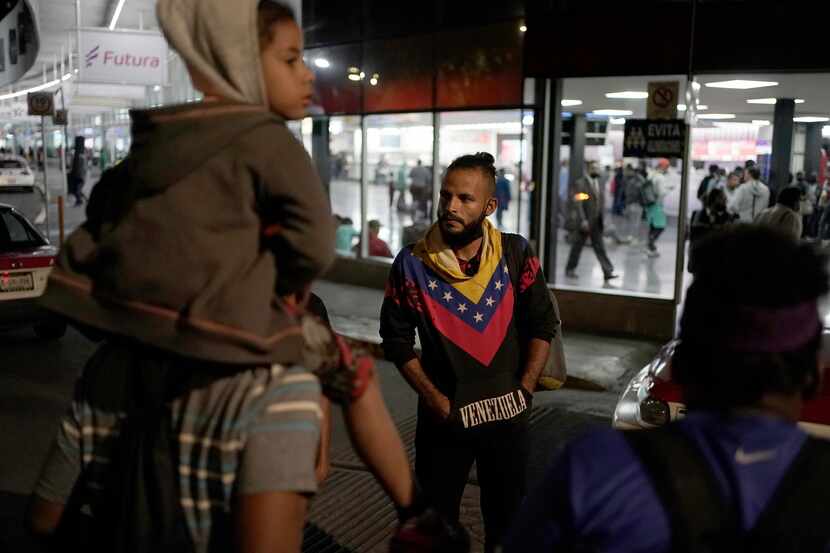 Venezuelan migrants wait for a bus to take them north, at the Northern Bus Station in Mexico...