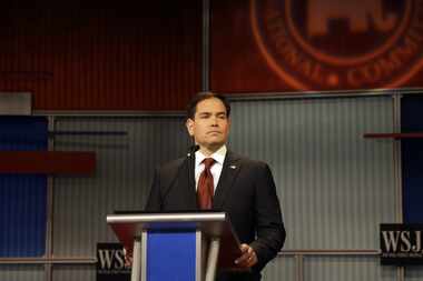  Marco Rubio stands alone during a Republican presidential debate in Milwaukee on Tuesday....