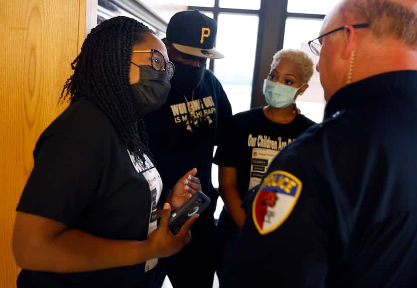 Mothers Tamara Lawrence (left) and Mioshi Johnson visited with Aledo ISD Police Chief Fred...