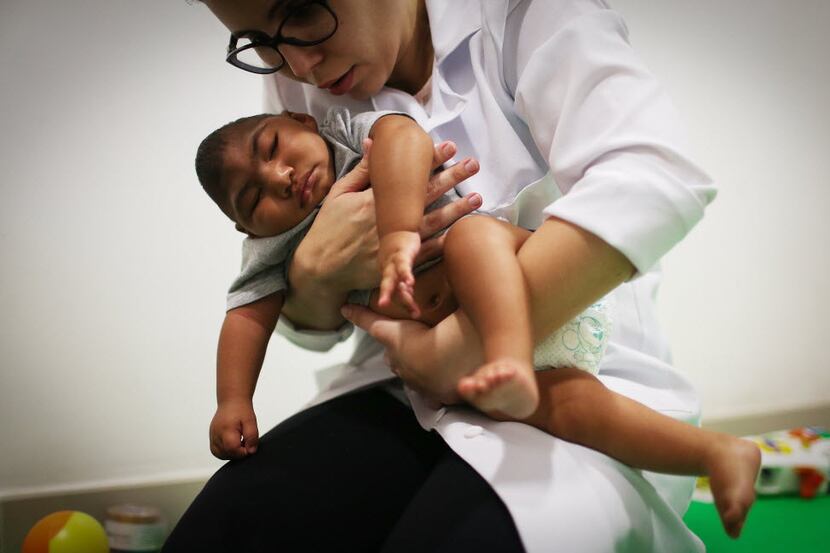 Dr. Stella Guerra performed physical therapy last month on an infant born with microcephaly...