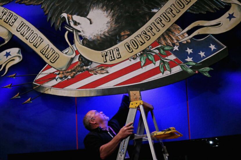 A production crew member adjusted lighting ahead of Thursday's vice presidential debate at...