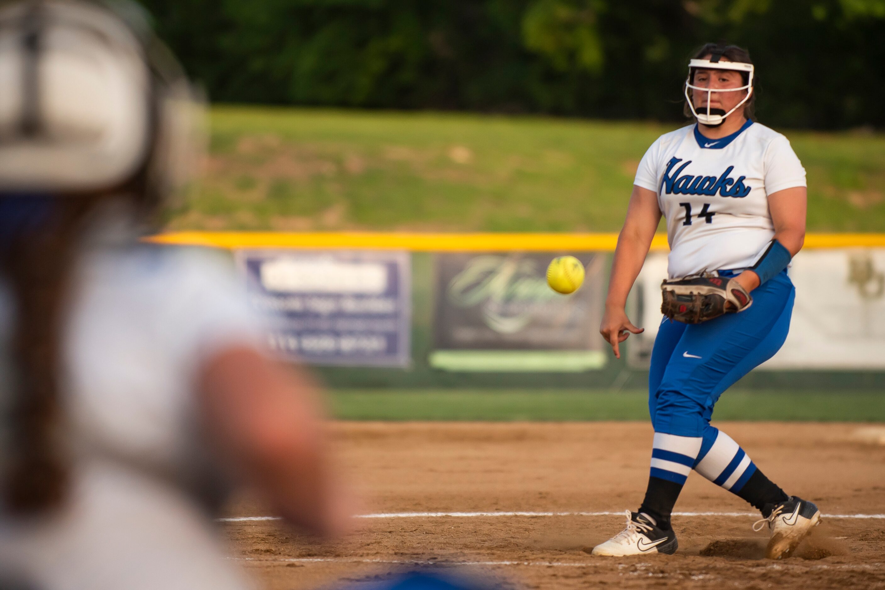 Hebron pitcher Lucy Crowder (14) delivers a pitch during the District 6-6A title game...