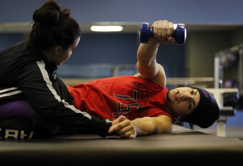 Lucas Da Cruz undergoes physical therapy twice a week at Project Walk Dallas in hopes of...