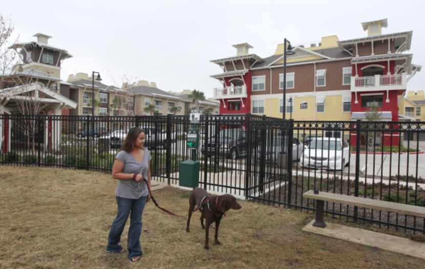 Donna Snyder takes Koko to the dog park at Hebron 121 Station, a convenience for pet lovers.