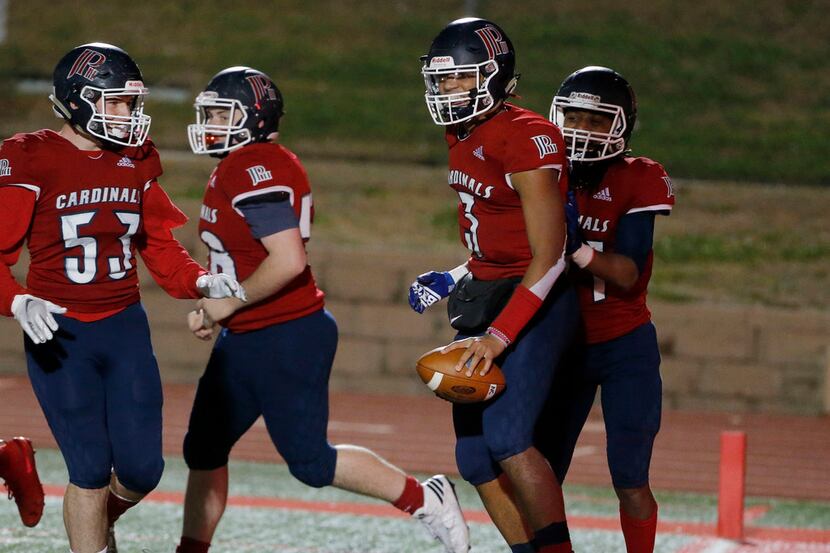 John Paul II quarterback Grayson James (3) celebrates his rushing touchdown against Nolan...