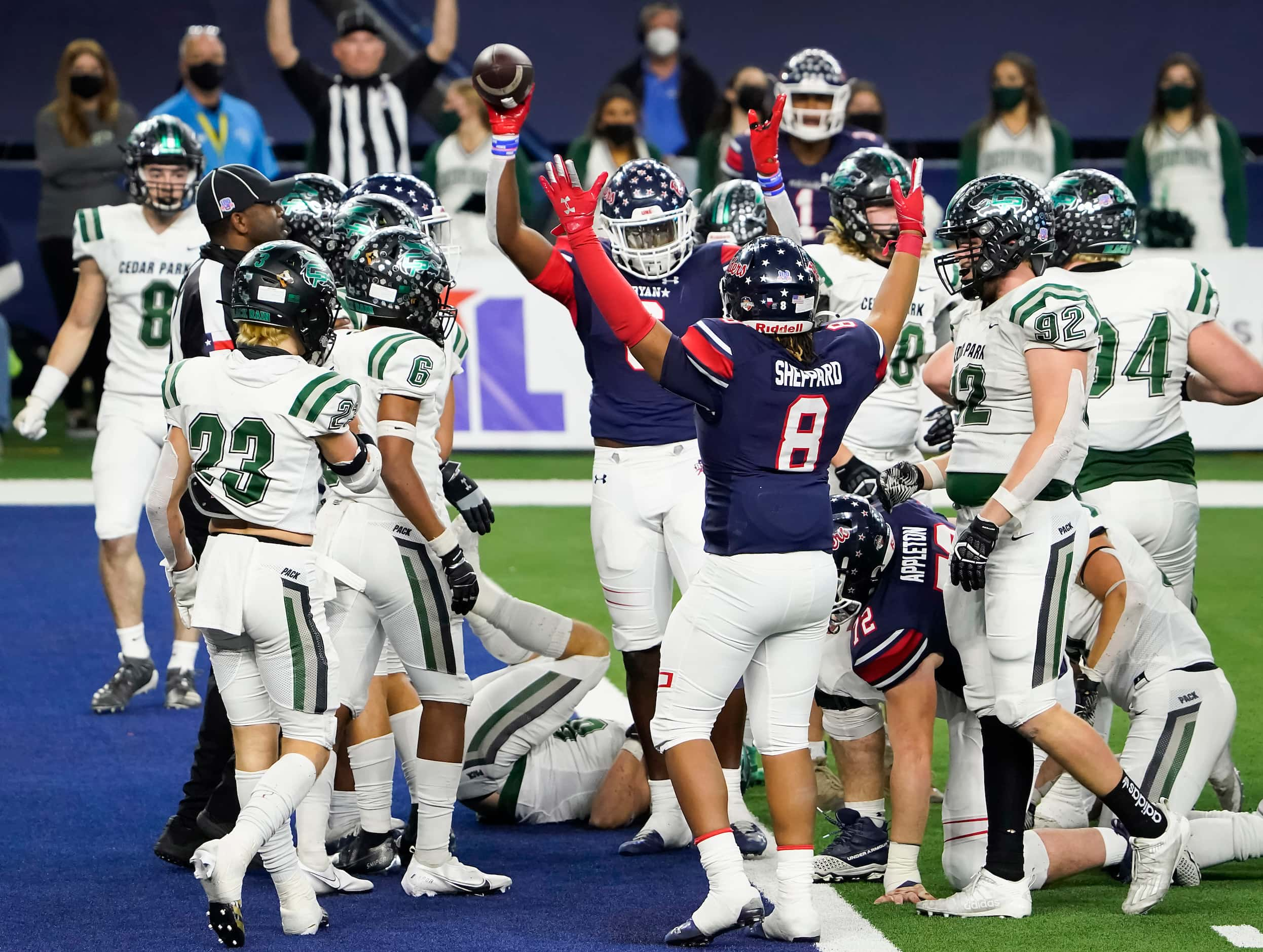 Denton Ryan Anthony Hill Jr. (6) celebrates with teammate Jay Sheppard (8) after scoring on...