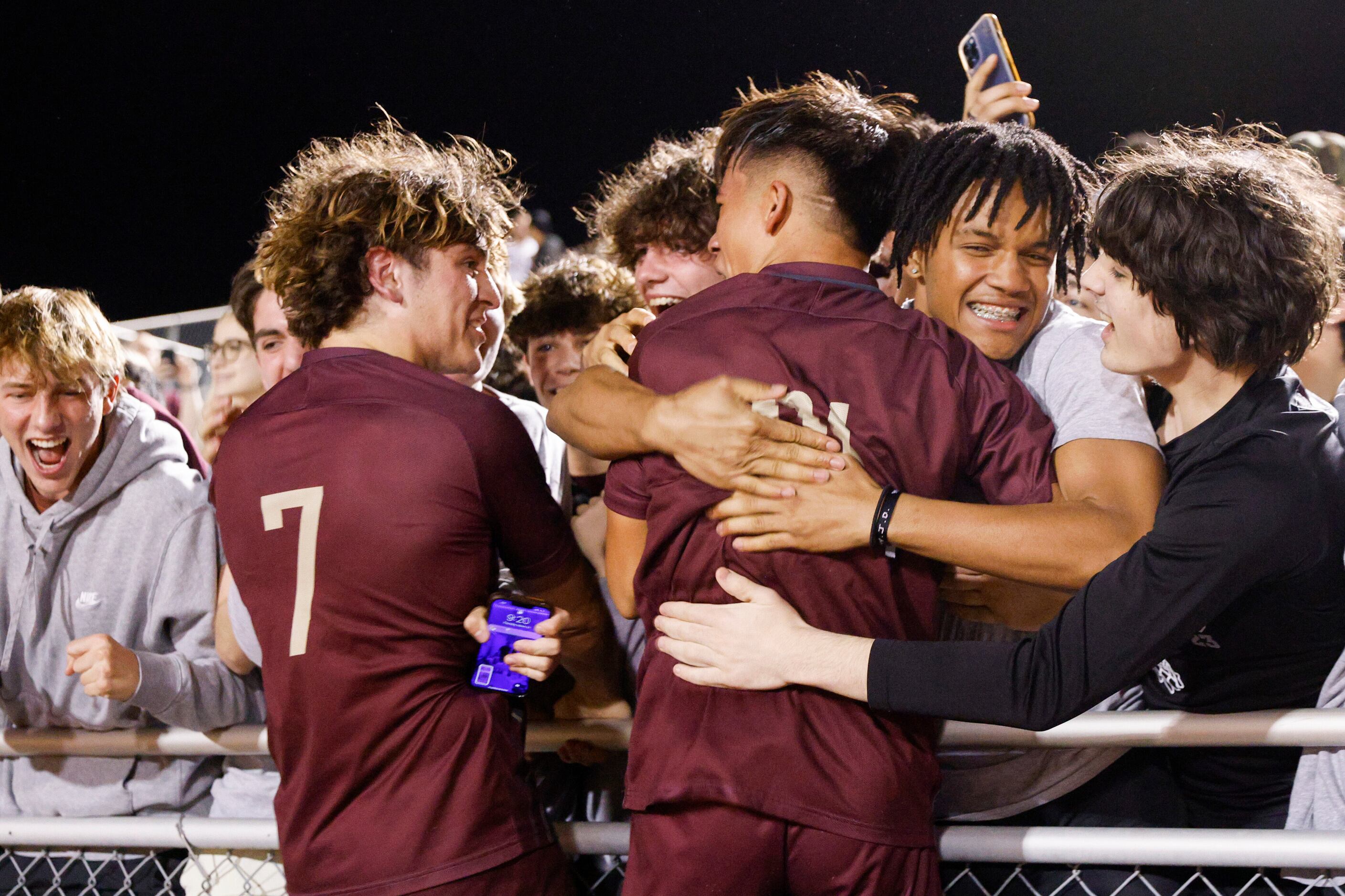 Frisco Heritage’s Omar Solorzano (7) and Joel Rodriguez (21) celebrate with their classmates...