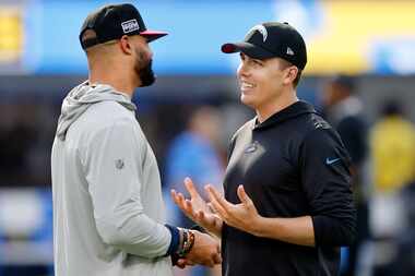 Dallas Cowboys quarterback Dak Prescott (left) visits with former Cowboys offensive...