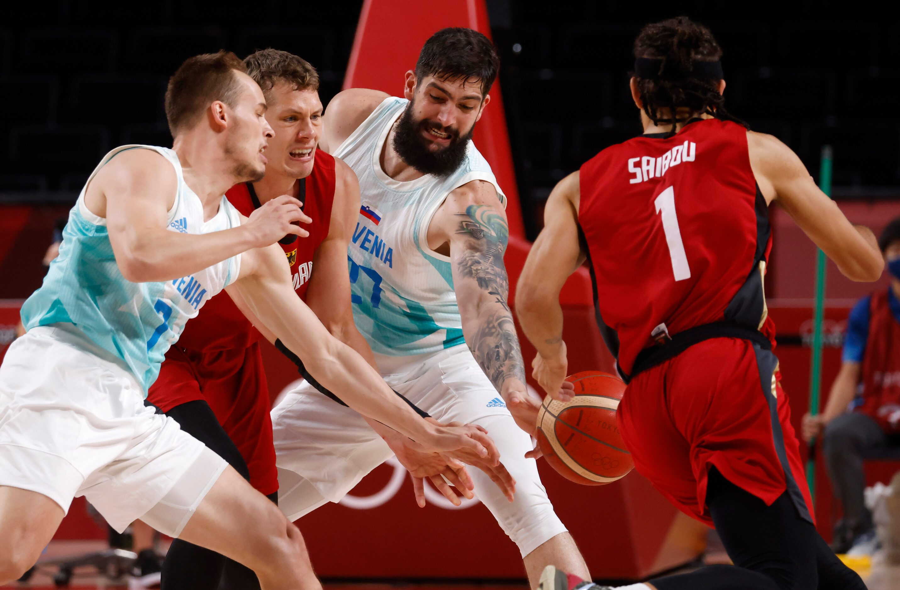 Slovenia’s Ziga Dimec (27) knocks the ball away from Germany’s Moritz Wagner (13) as he...