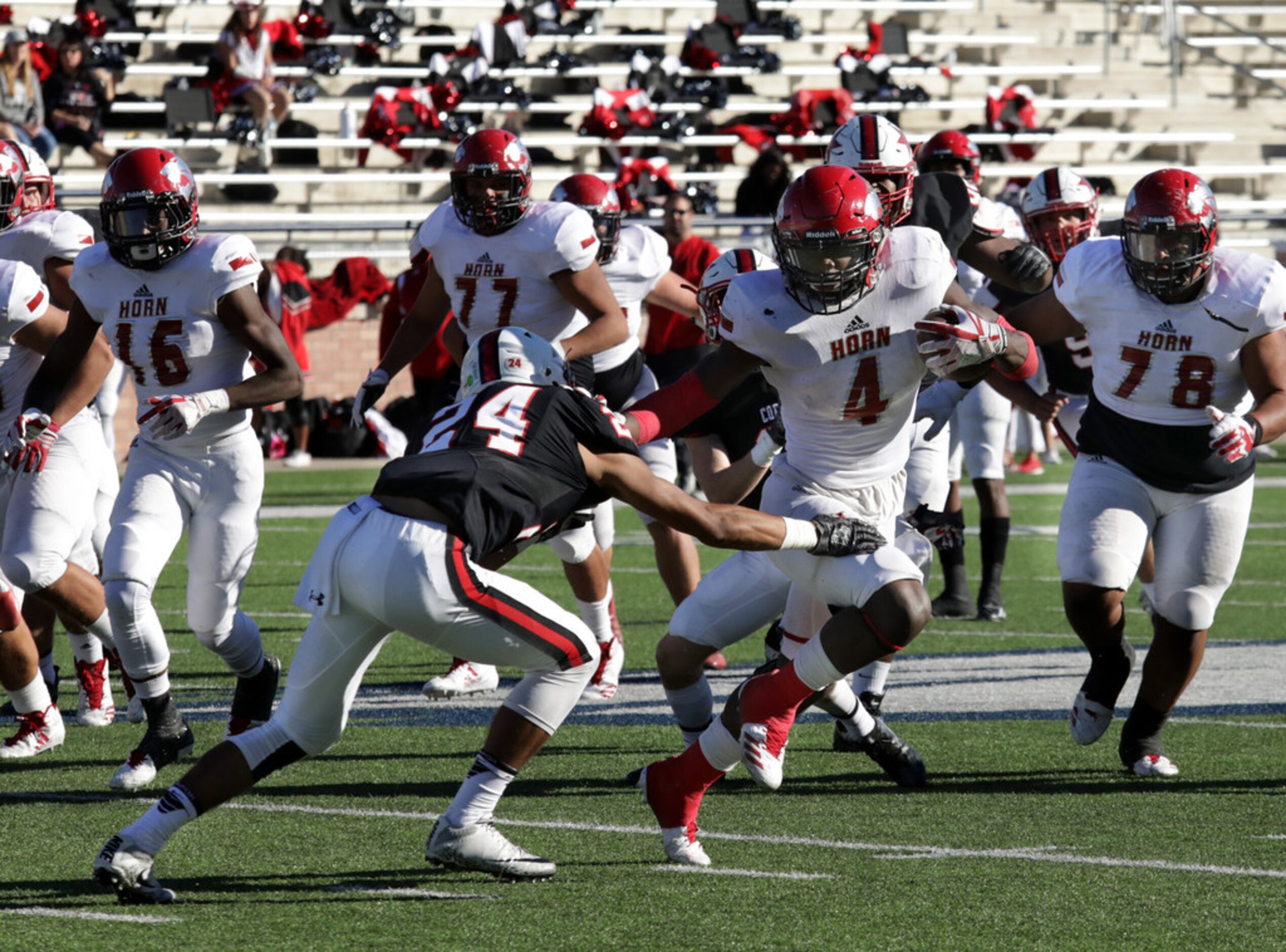 Horn player 4, Esaias Taylor, breaks past Coppell player 24, Gabe Lemons, in a Class 6A...