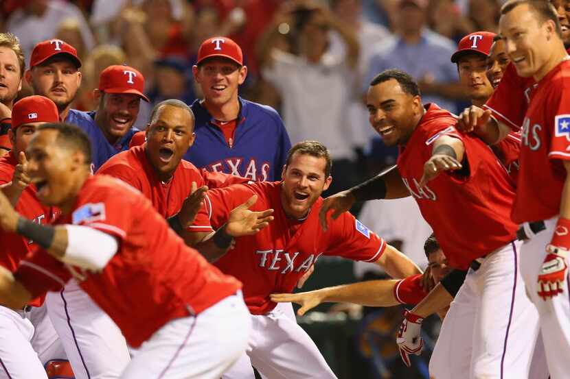 ARLINGTON, TX - JULY 29:  The Texas Rangers celebrate a walk off homerun by Geovany Soto #8...