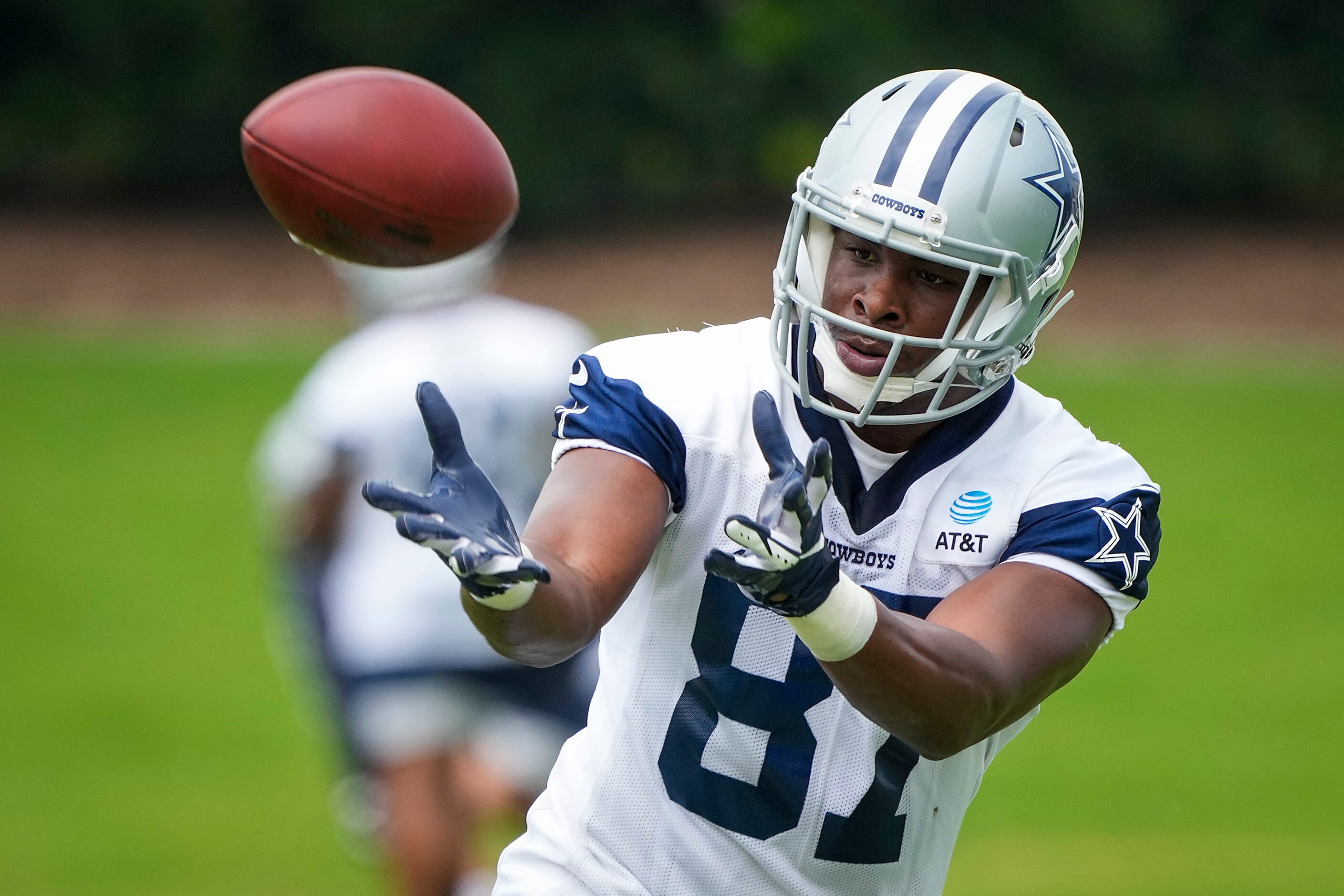 Dallas Cowboys tight end Jeremy Sprinkle (87) makes a catch while participating in a drill...