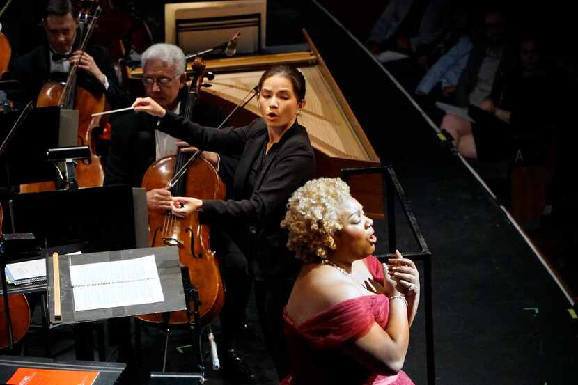 An image of Molly Turner conducting the Dallas Opera Orchestra during the Dallas Opera Hart...