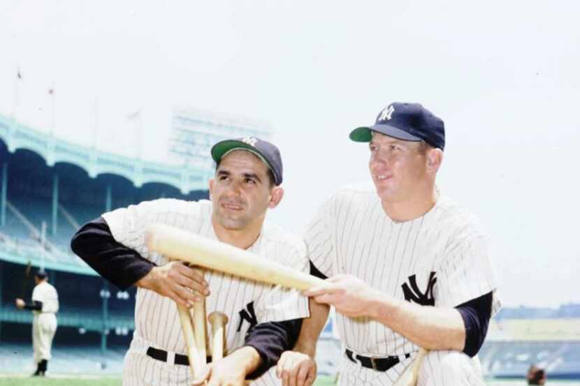 Mickey Mantle (right) and Yogi Berra were heavy hitters for the Yankees in 1956.