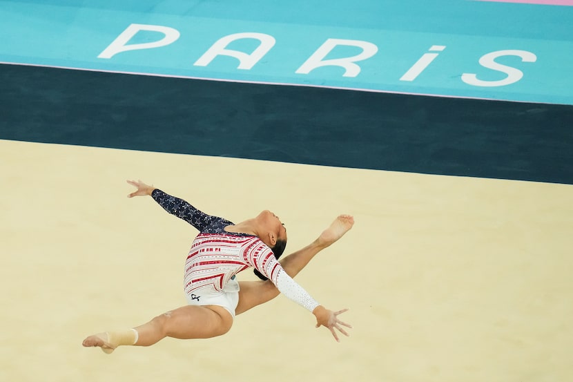 Suni Lee of the United States competes on the floor during the women’s gymnastics team final...