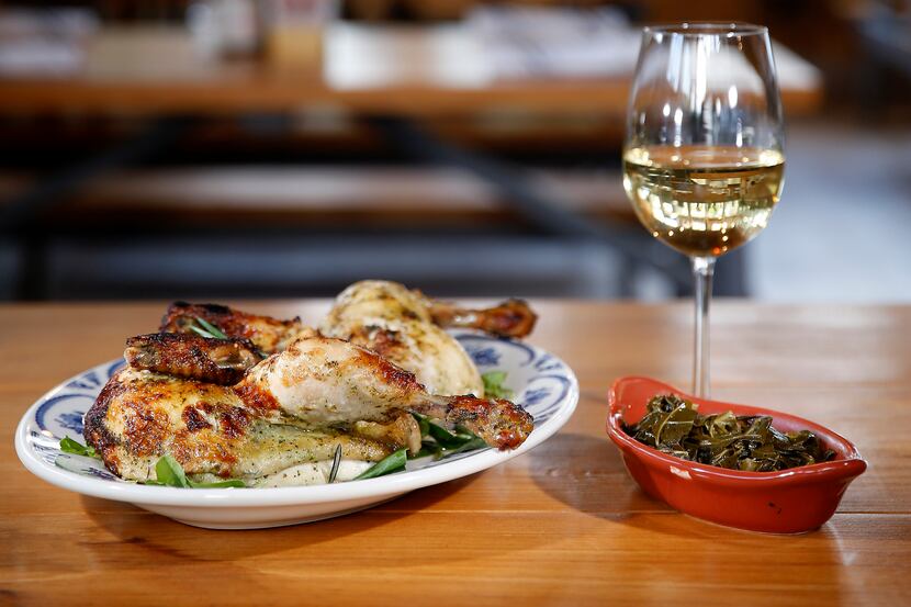 A plate of rotisserie style whole chicken marinated in herbs and citrus and side of braised...