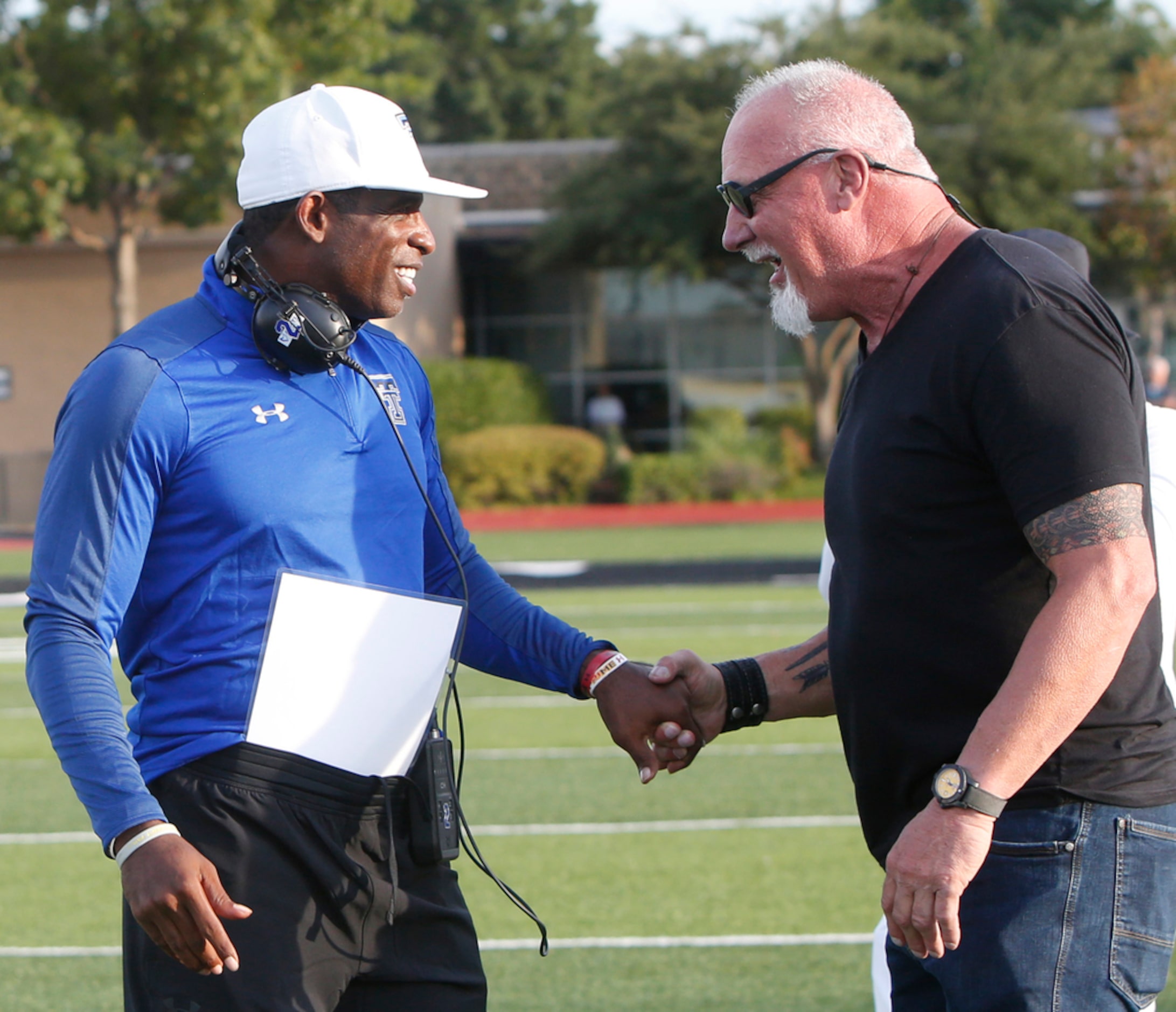 NFL Hall of famers and former Dallas Cowboys players Deion Sanders, left, and Randy White...