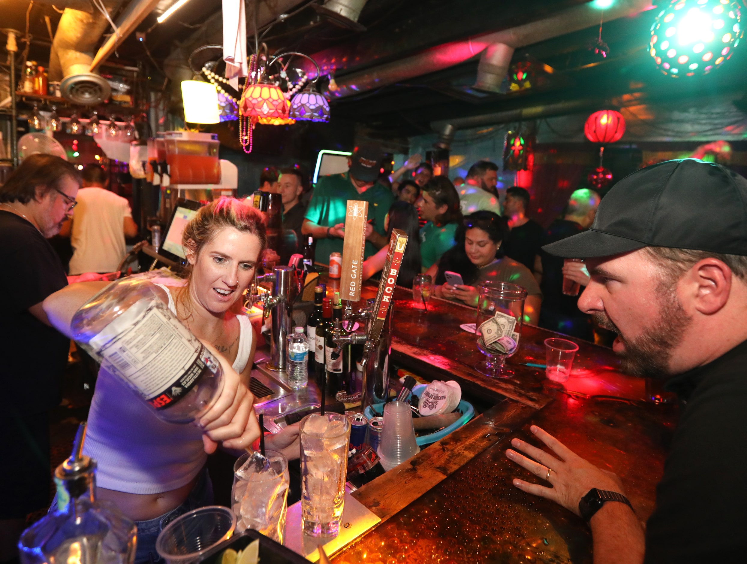 Kelsey Whiting mixes drinks at the Grapevine Bar in Dallas, TX, on Aug 23, 2023.  (Jason...