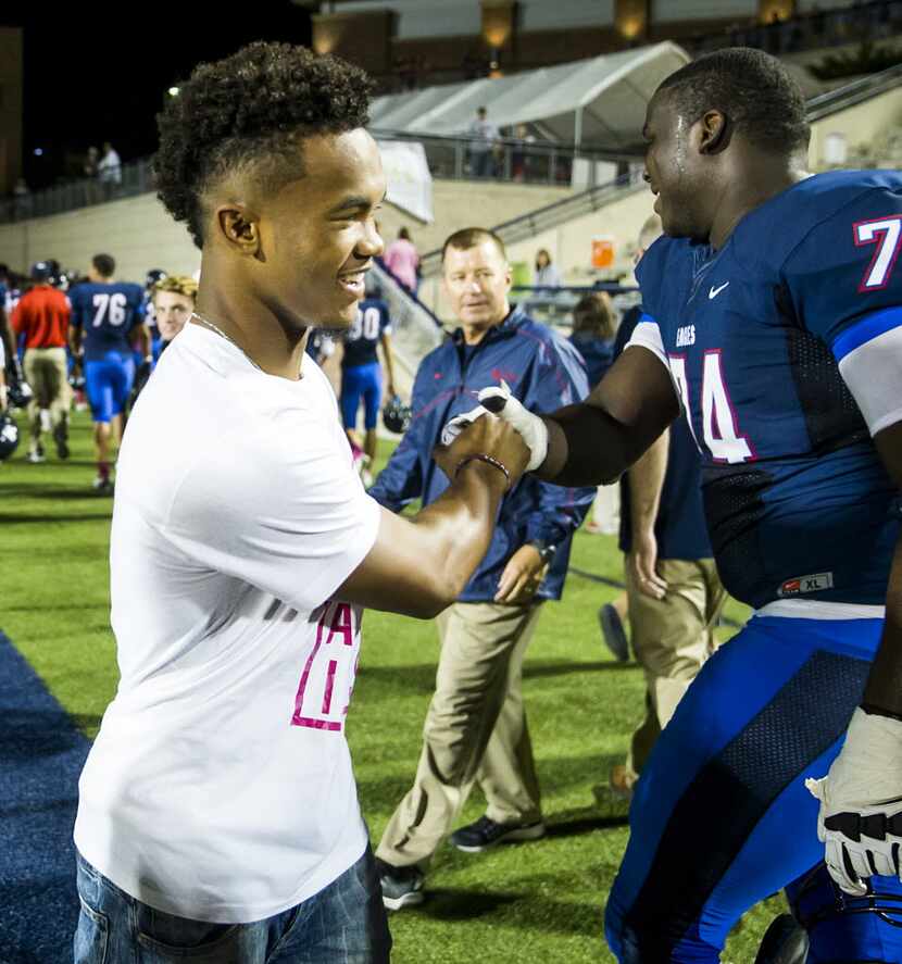 Former Allen, now Texas A&M, quarterback  Kyler Murray shakes hands with offensive lineman ...