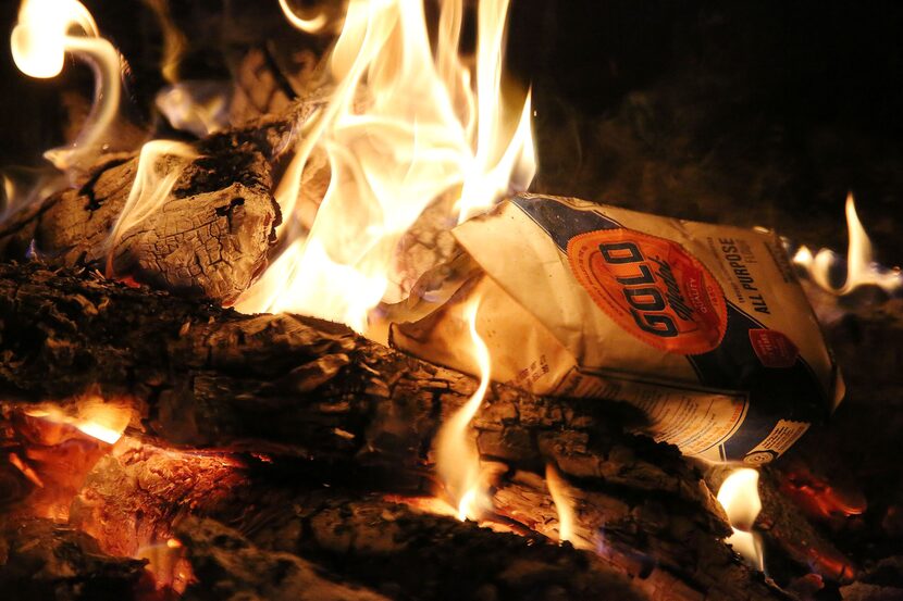  A bag of flour burns after Caitlin Fehrenbacher, of Dallas, threw the leavened products...