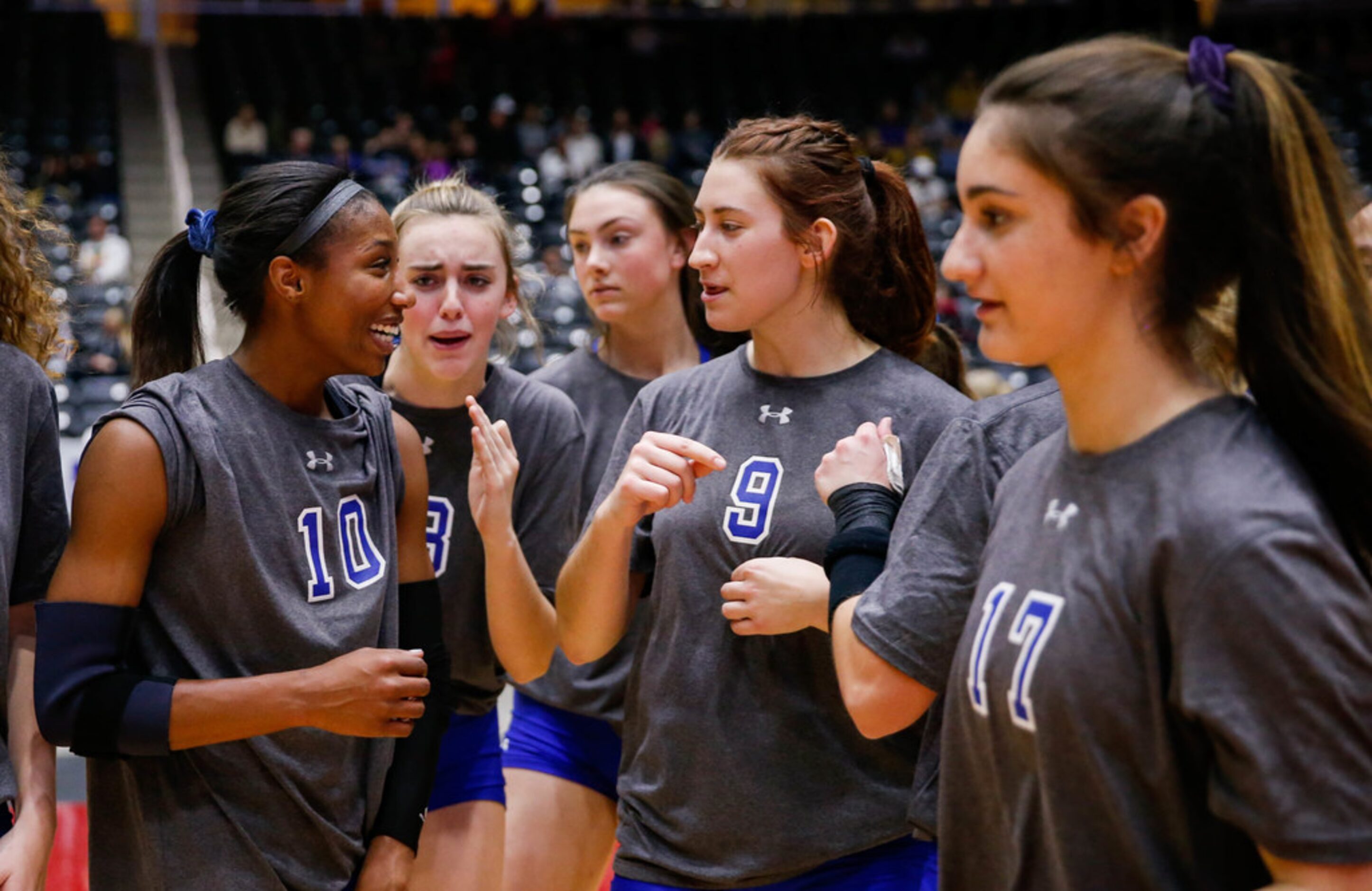 The Byron Nelson Bobcats celebrate after winning a class 6A volleyball state semifinal match...