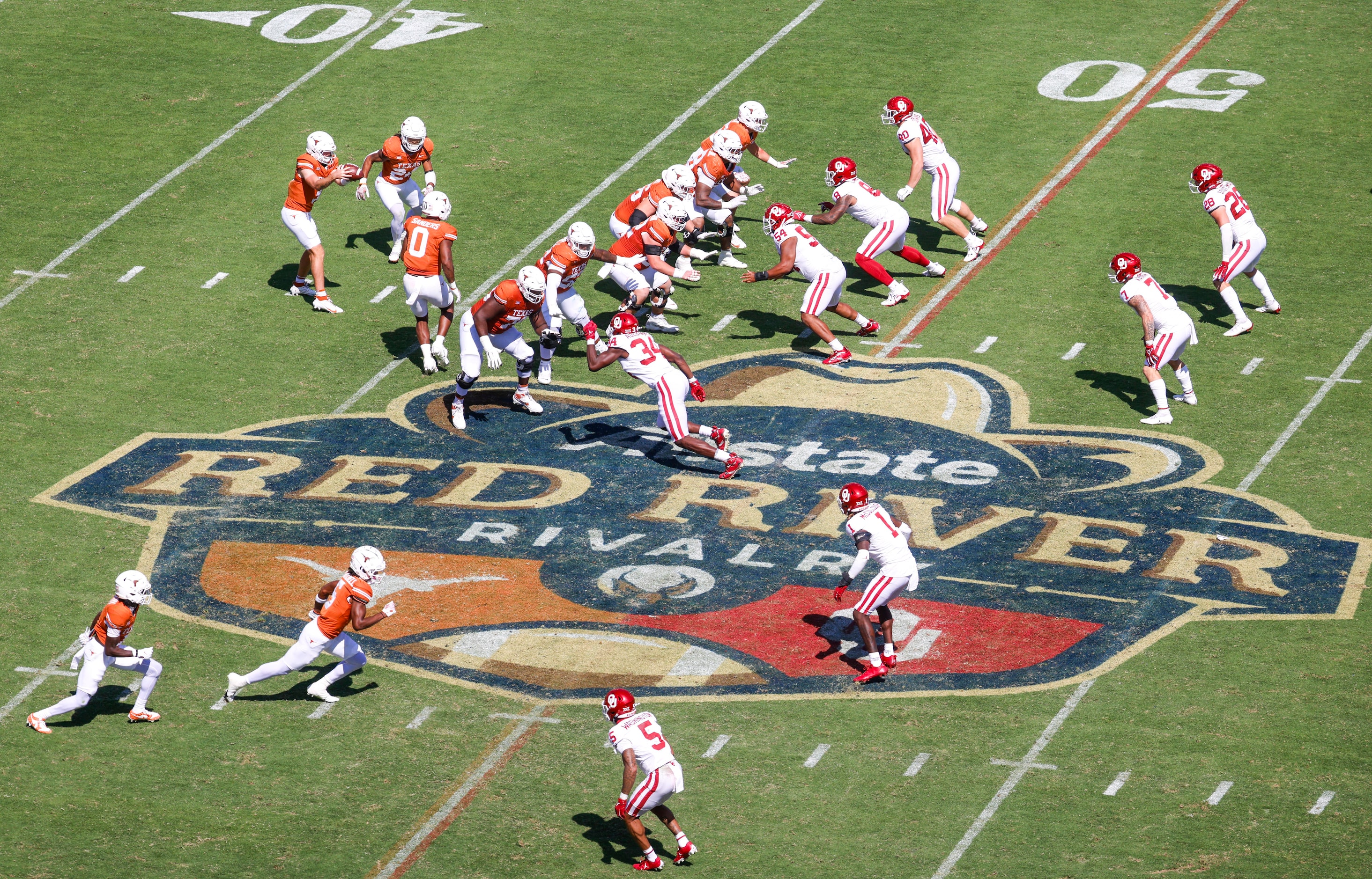 Texas compete against Oklahoma during the Red River Rivalry at the Cotton Bowl, on Saturday,...