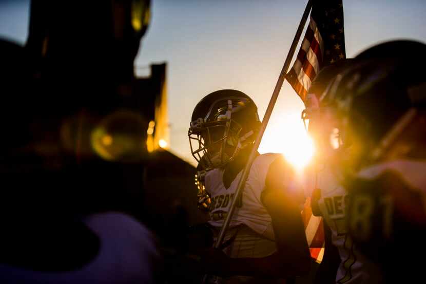 Desoto football players prepare to run in to the stadium before a District 7 6A high school...