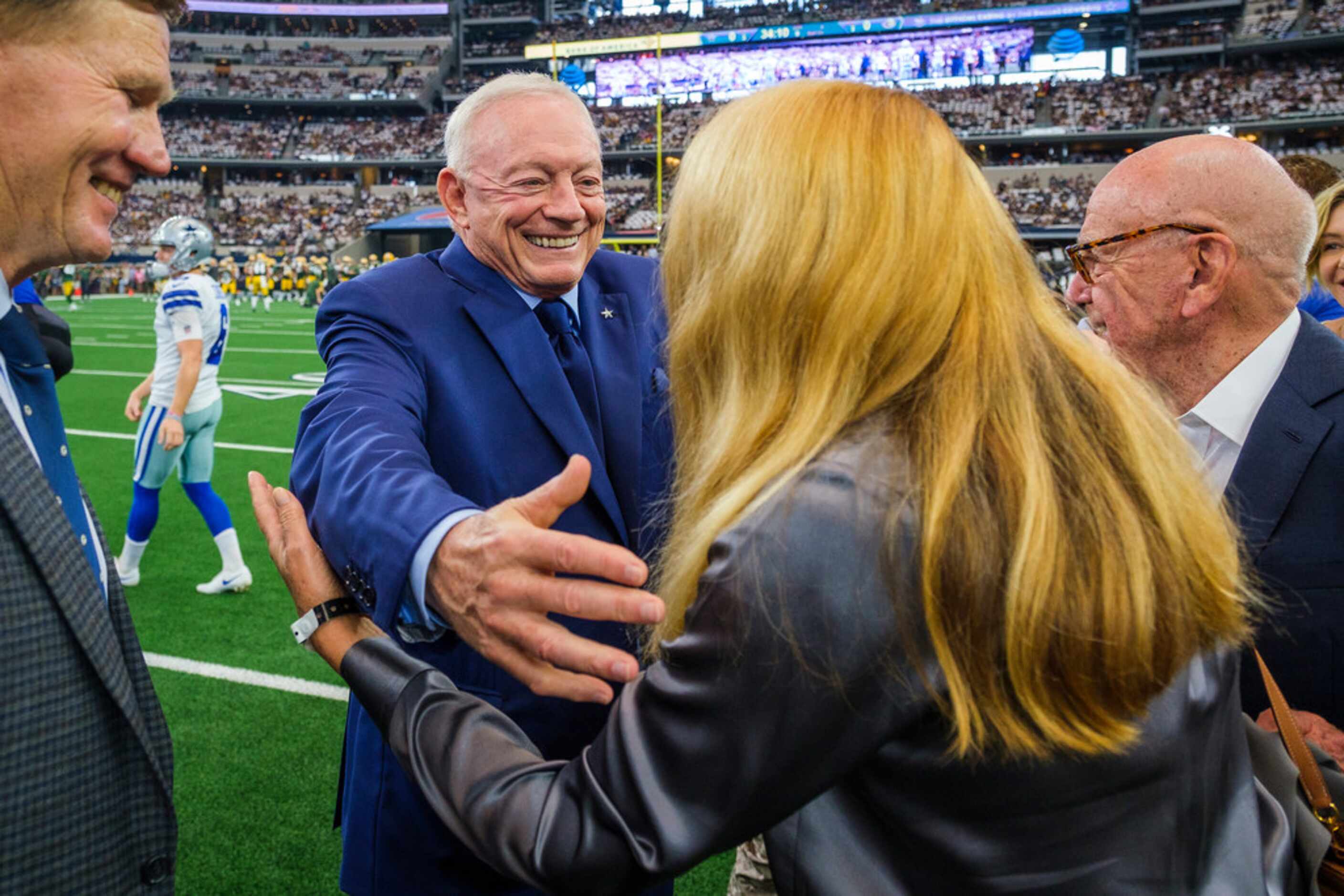 Jerry Jones greets guests before an NFL football game against the Green Bay Packers at AT&T...