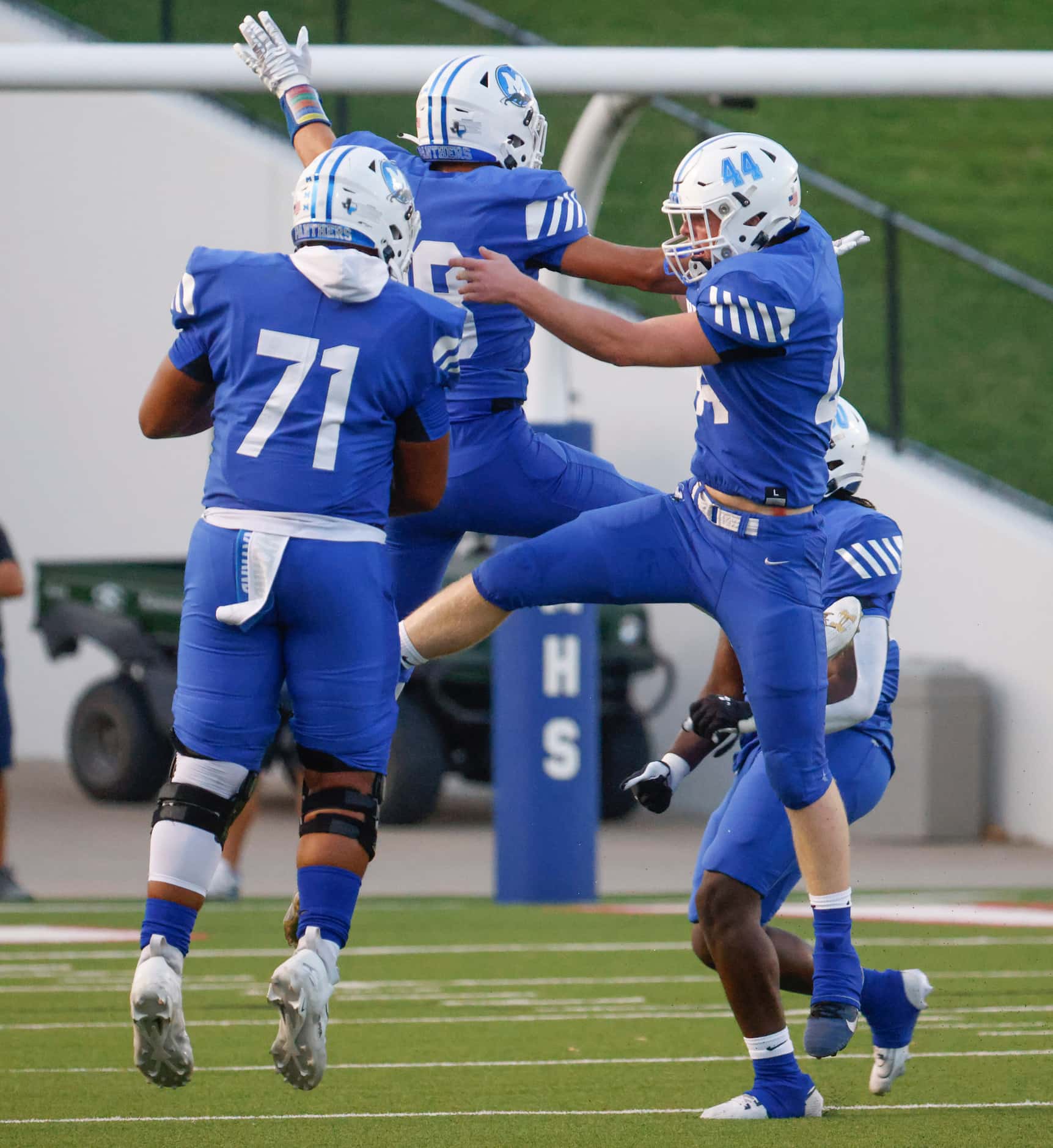 Midlothian high players cheer after an intercept during the first half of a football game...