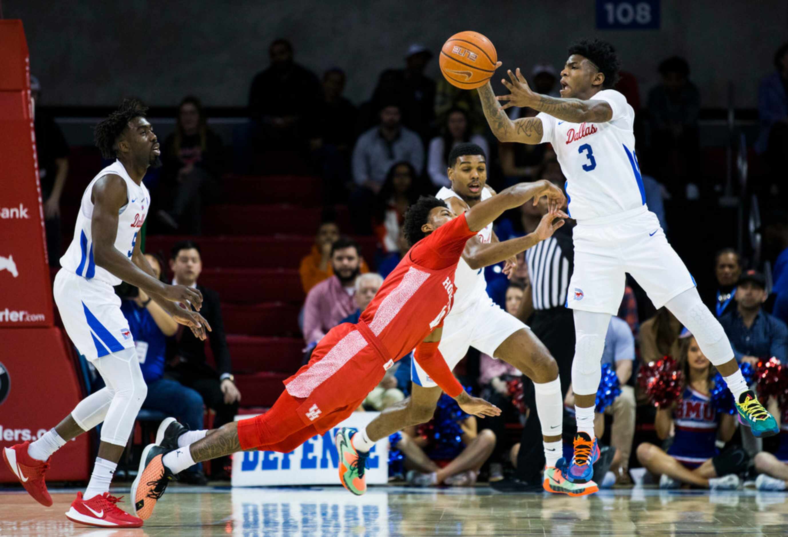 Southern Methodist Mustangs guard Kendric Davis (3) reaches for a loose ball over Houston...